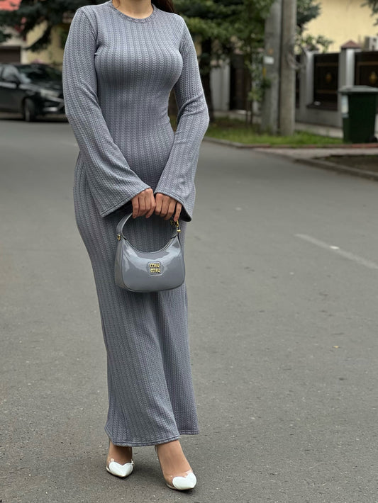Gray knit maxi dress with ruffles and long sleeves.